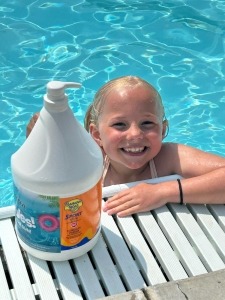 Child at the Albert City pool next to the sunscreen