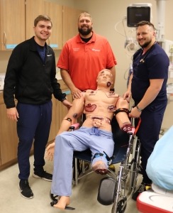 Charlie Flickinger, RN, Dr. Garrett Feddersen, BVRMC ER Medical Director, and Zach Green, RN and house supervisor stand by the “Rescue Randy” moulage manikin.