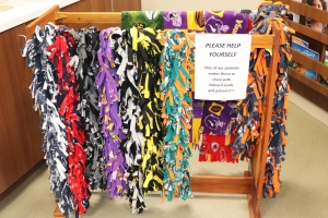 Hand-made scarves in various colors on a rack at BVRMC's Oncology & Infusion Center